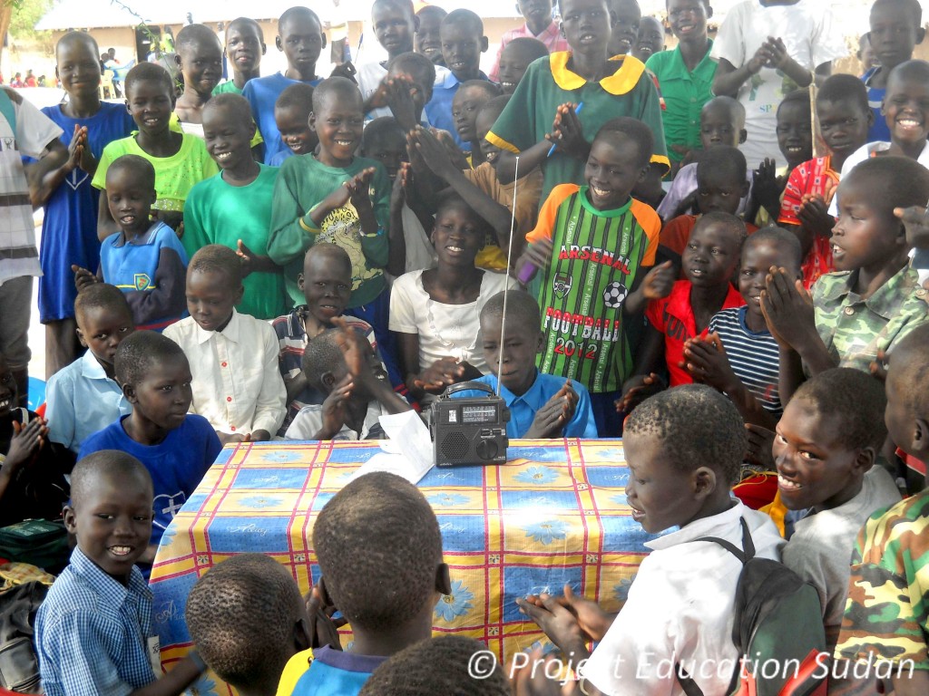Students in South Sudan listen to their favorite shortwave radio program, VOA Learning English.