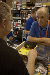 CommRadio's president, Don Moore, working with a customer at the Universal Radio booth.
