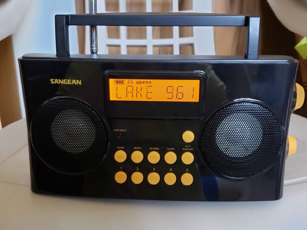 Photo of the Sangean PR-D17 AM FM Radio while tuned to 96.1 FM and showing RDS backlit display